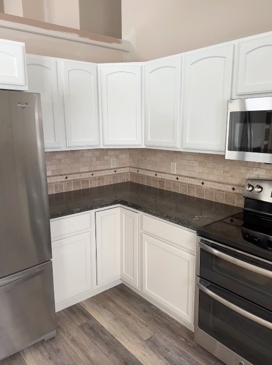Kitchen with freshly painted white cabinets